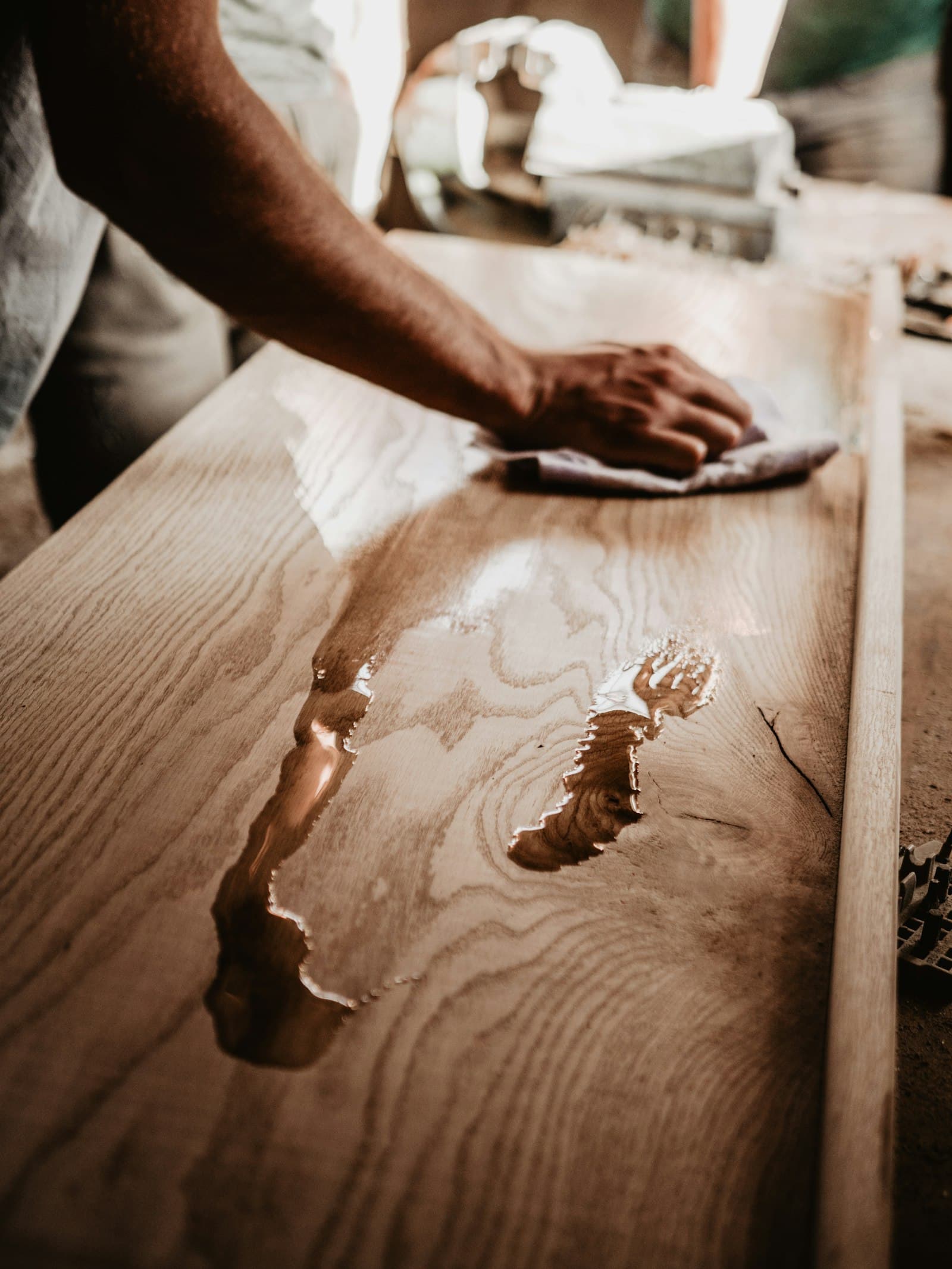 Polishing a mahogany panel by hand